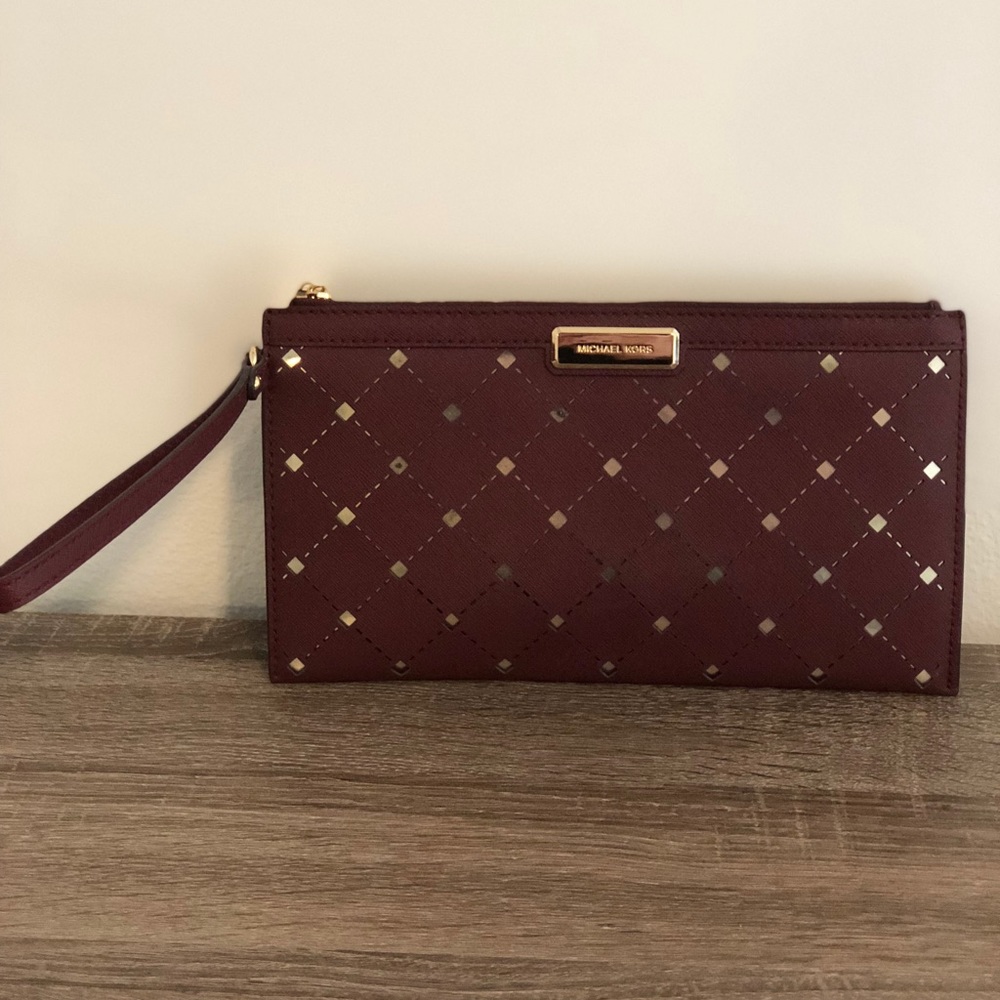 Michael Kors burgundy and gold wristlet